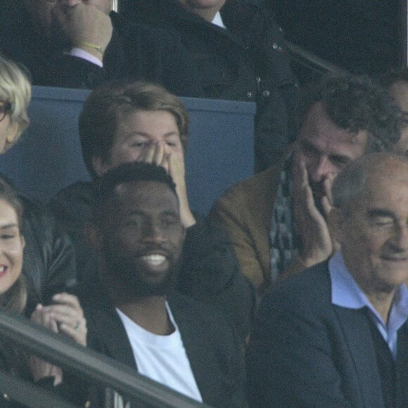 Marina Foïs et Eric Lartigau avec leur fils George au match de Ligue Des Champions 2022 (LDC) "PSG- Macabi Haifa (7-2)" au Parc des Princes à Paris le 25 octobre 2022.