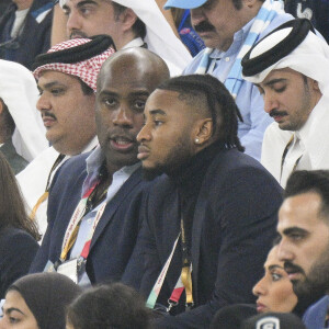 Teddy Riner - Christophe Nkunku et Stephanie Frappart dans les tribunes du match "France - Argentine (3-3 - tab 2-4)" en finale de la Coupe du Monde 2022 au Qatar, le 18 décembre 2022.