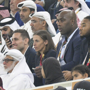 Teddy Riner - Christophe Nkunku et Stephanie Frappart dans les tribunes du match "France - Argentine (3-3 - tab 2-4)" en finale de la Coupe du Monde 2022 au Qatar, le 18 décembre 2022.