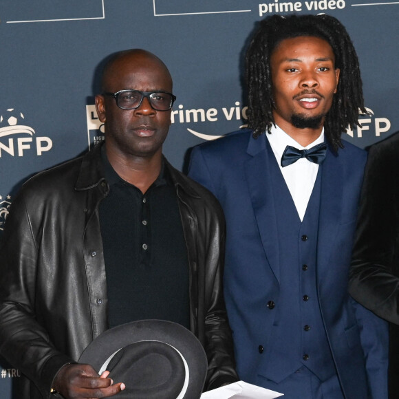 Lilian Thuram et son fils Khephren Thuram - Photocall de la cérémonie des Trophées UNFP 2022 au Pavillon Gabriel à Paris le 15 mai 2022. © Coadic Guirec/Bestimage 
