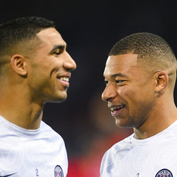 Kylian Mbappé et Achraf Hakimi - Match retour de Ligue Des Champions entre le PSG et Benfica au Parc des Princes à Paris.