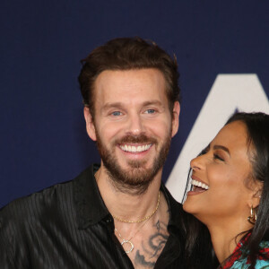 Matt Pokora et sa femme Christina Milian au photocall lors de la première du film "Ambulance" à Los Angeles le 4 avril 2022.