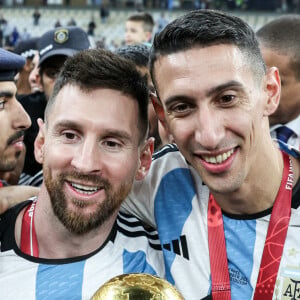 Lionel Messi et Angel Di Maria fêtent leur troisième titre de Champions du Monde après leur victoire face à la France en finale de la Coupe Du Monde 2022 au Qatar. Doha, le 18 décembre 2022.