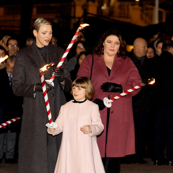 La princesse Charlène de Monaco avec ses enfants la princesse Gabriella de Monaco, comtesse de Carladès, et le prince Jacques de Monaco, marquis des Baux, Mélanie-Antoinette de Massy - La famille princière de Monaco participe à l'embrasement de la barque lors des célébrations de la Sainte-Dévote sur le quai Albert 1er à Monaco le 26 janvier 2023. © Claudia Albuquerque / Bestimage