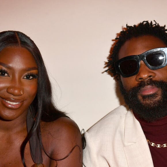 Aya Nakamura et Damso - Photocall en front row du défilé "Le Raphia" de la maison Jacquemus au Bourget le 12 décembre 2022. © Veeren / Clovis / Bestimage  Front row photo of the Jacquemus fashion show "Le Raphia" at Le Bourget on 12 December 2022.