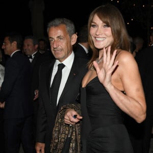 Carla Bruni et son mari Nicolas Sarkozy à la soirée "Women In Motion" par Kering au Château de la Castre lors du 75ème Festival International du Film de Cannes, le 22 mai 2022.
