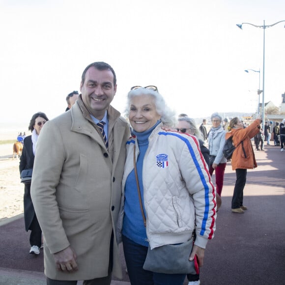 Exclusif - Christophe Blanchet (Député du Calvados), Martine Lelouch - Inauguration de la "Promenade Claude Lelouch" qui porte désormais son nom en présence d'un public nombreux et de la famille du réalisateur à Villers-sur-Mer le 26 mars 2023. © Jack Tribeca / Bestimage