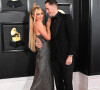 Mariée à l'auter Carter Reum, le couple a fait appel à une mère porteuse pour leur premier enfant.
Paris Hilton et son mari Carter Reum au photocall de la cérémonie des 65ème Grammy Awards à Los Angeles le 5 février 2023.