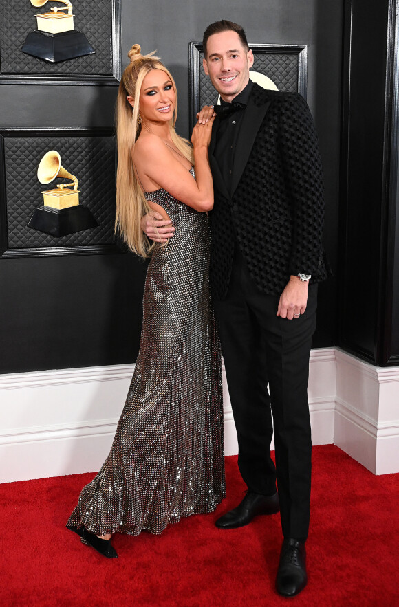 La chanteuse avait révélé le prénomde son fils (inspiré par la mythologie grecque) dans son propre podcast quelques mois plus tôt.
Paris Hilton et son mari Carter Reum au photocall de la cérémonie des 65ème Grammy Awards à Los Angeles le 5 février 2023. 