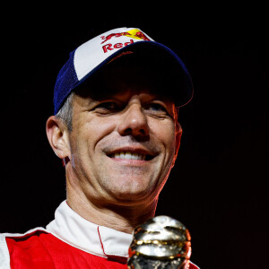 Le pilote français est une légende des sports automobiles avec notamment 9 titres de champion du monde des rallyes

Sébastien Loeb - Podium du "Dakar 2023" à Amman en Arabie Saoudite, le 15 janvier 2023.