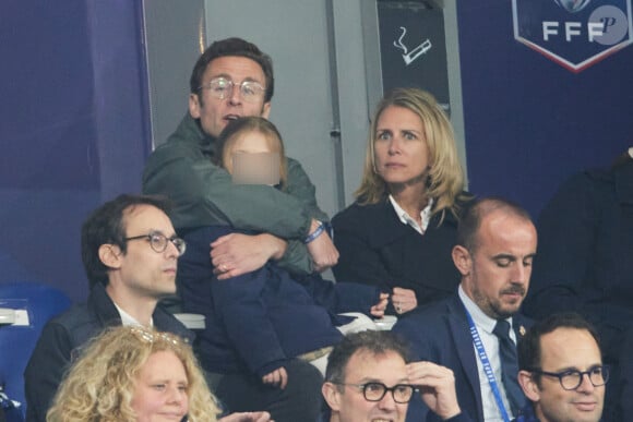 Laurent Macron en famille lors du match de football de la Coupe de France "Nantes vs Toulouse" au Stade de France à Paris. Le 29 avril 2023 © Cyril Moreau / Bestimage