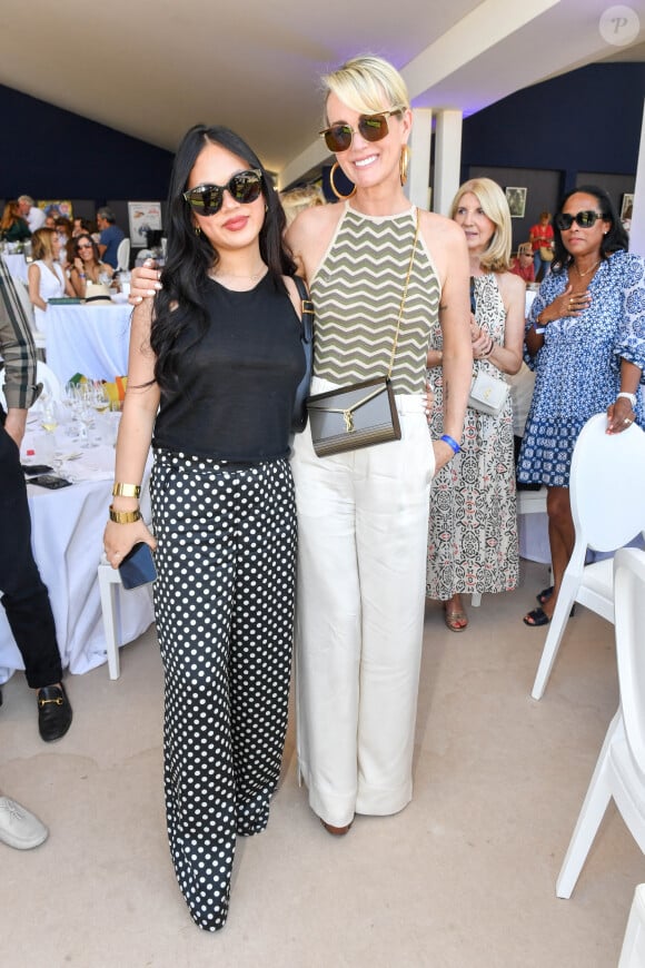 Exclusif - Laeticia Hallyday et sa fille Joy dans l'Espace VIP lors de la 9ème édition du "Longines Paris Eiffel Jumping" au Champ de Mars à Paris, France, le 25 juin 2023. © Perusseau-Veeren/Bestimage 