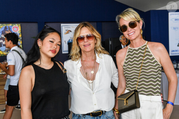 Exclusif - Laeticia Hallyday avec sa fille Joy et Virginie Coupérie-Eiffel dans l'Espace VIP lors de la 9ème édition du "Longines Paris Eiffel Jumping" au Champ de Mars à Paris, France, le 25 juin 2023. © Perusseau-Veeren/Bestimage 