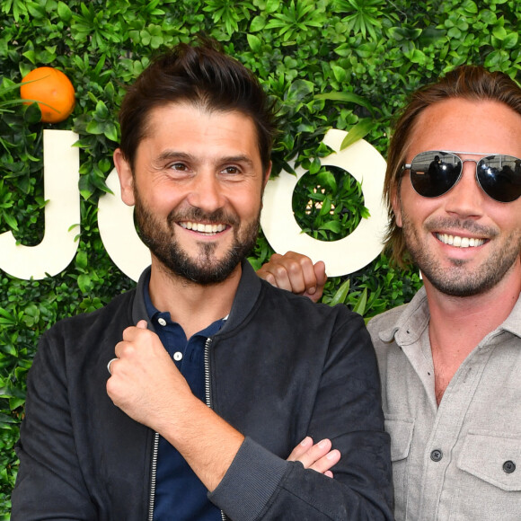 Christophe Beaugrand et son mari Ghislain Gerin - Soirée d'anniversaire des 5 ans de la marque Joone, sur la péniche La Barge à Issy-les-Moulineaux. Paris, le 30 juin 2022 © Veeren / Bestimage