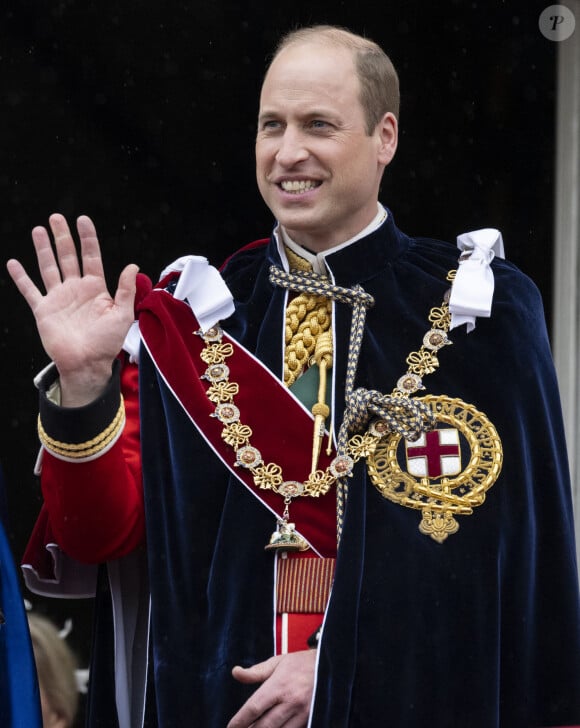 Le prince William salue la foule sur le balcon du palais de Buckingham lors de la cérémonie de couronnement du roi d'Angleterre à Londres, le 5 mai 2023. 