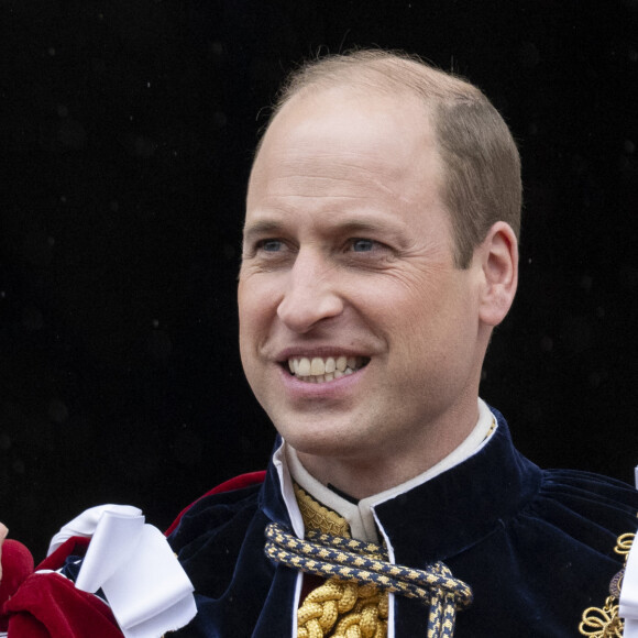 Le prince William salue la foule sur le balcon du palais de Buckingham lors de la cérémonie de couronnement du roi d'Angleterre à Londres, le 5 mai 2023. 