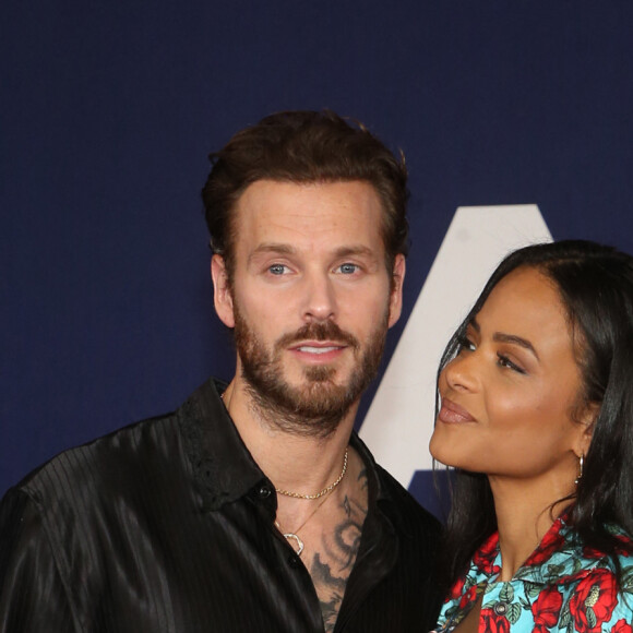 Matt Pokora et sa femme Christina Milian au photocall lors de la première du film "Ambulance" à Los Angeles le 4 avril 2022. 
