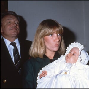 Jeanne Marie Martin, le jour de son baptème avec sa marraine, la première femme de Nicolas Sarkozy aux côtés de Jacques Martin et Cécilia.