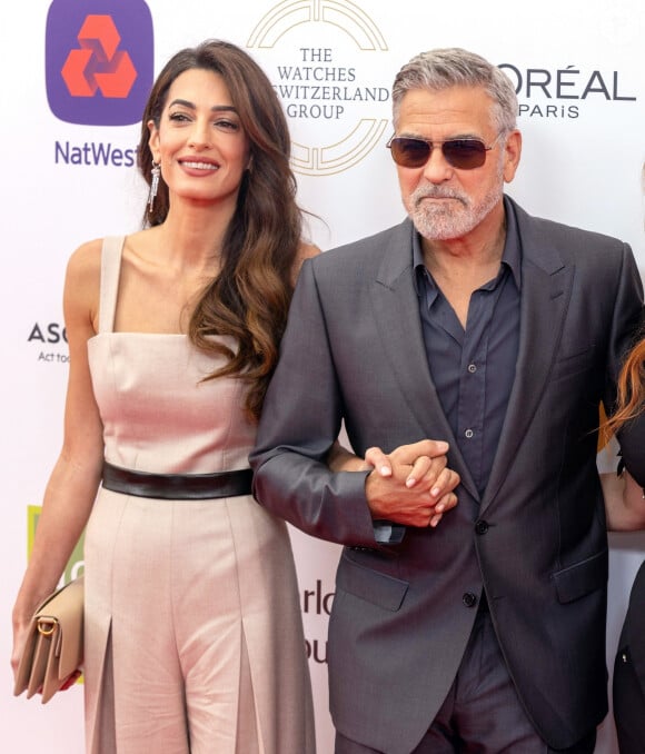 George Clooney et sa femme Amal Clooney arrivent à la soirée "Prince's Trust Awards à Londres, le 15 mai 2023. 