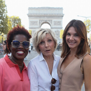 Exclusif - Claudia Tagbo, Evelyne Dhéliat, Alice Detollenaere - Backstage du défilé de l'association Ruban Rose à l'occation du lancement d'octobre rose sur les Champs Elysées à Paris, France, le 01 octobre 2023. Cette année, l'association Ruban Rose à l'origine du projet fête ses 20 ans. À l'occasion du 1er octobre, elle a réuni sur les Champs-Elysées 99 femmes et 1 homme, atteints, en rémission ou guéris du cancer du sein, aux côtés de 100 blouses blanches (chercheurs, médecins, soignants). E. Dhéliat, C. Tagbo et A. Detollenaere, marraines de l'association et touchées elles aussi par le cancer du sein, étaient présentes à leurs côtés. Au fil des éditions, certaines se réengagent et poursuivent ainsi la dynamique de cohésion et de soutien auprès de l'association Ruban Rose. L'évènement a été mis en musique par la chanteuse Jenifer et chorégraphié par M.Kerkouche. Trois monuments emblématiques français se sont illuminés en rose pour contribuer à la sensibilisation aux côtés de l'Association : l'Arc de Triomphe, la tour Eiffel, et l'Assemblée nationale. © Christophe Clovis / Bestimage 