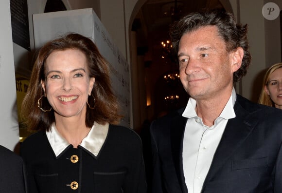 Carole Bouquet et son compagnon Philippe Sereys de Rothschild - Photocall de la 4ème édition du Gala " Planet Finance" au Carlton lors du 67ème festival international du film de Cannes. Le 15 mai 2014. 