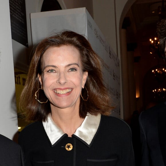 Carole Bouquet et son compagnon Philippe Sereys de Rothschild - Photocall de la 4ème édition du Gala " Planet Finance" au Carlton lors du 67ème festival international du film de Cannes. Le 15 mai 2014. 