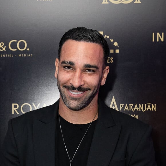 Adil Rami complimente une chanteuse française
 
Exclusif - Adil Rami - Soirée à la suite Sandra & Co lors du 76ème Festival International du Film de Cannes. © Aurelio Stella /Bestimage