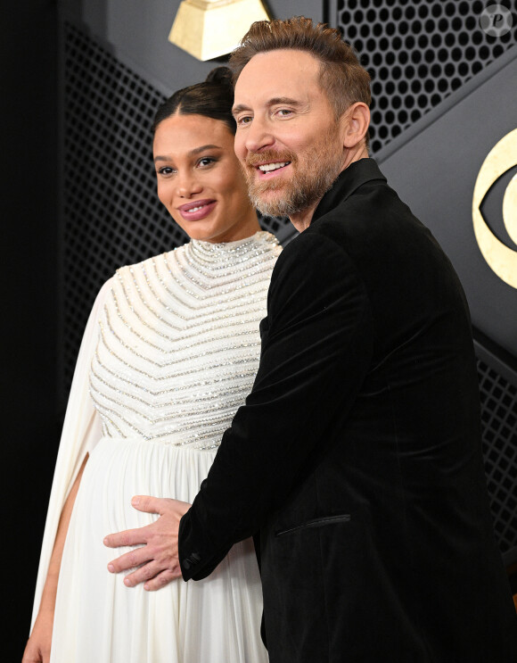 David Guetta et sa compagne Jessica Ledon, enceinte - 66e édition des Grammy Awards à la Crypto.com Arena à Los Angeles le 4 février 2024.