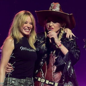 Elles ont interprété, ensemble, le titre I Will Survive de Gloria Gaynor afin de le dédier à toutes celles et tous ceux qui se battent, aux survivantes et aux survivants.
Madonna invite Kylie Minogue sur la scène du Kia Forum de Los Angeles dans le cadre de son Celebration Tour. Le 7 mars 2024.