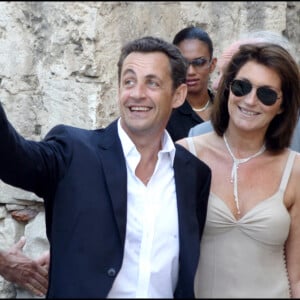 Nicolas Sarkozy et son épouse de l'époque Cécilia lors du mariage de Jean Reno et Zofia en 2006