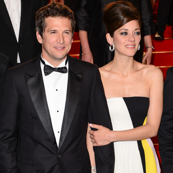 Baisers échangés ou démonstrations plus discrètes, comme ici Guillaume Canet et Marion Cotillard, le Festival déchaîne les passions.
Guillaume Canet, Marion Cotillard quittant la projection de Blood Ties au Palais des Festivals dans le cadre du 66e Festival de Cannes à Cannes, France. Photo par Nicolas Briquet/ABACAPRESS.COM