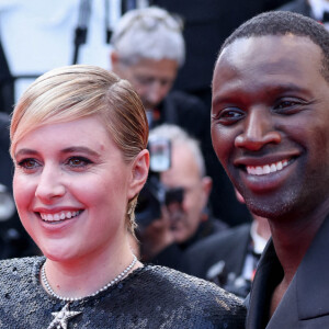 La présidente du jury Greta Gerwig et le membre du jury Omar Sy assistent au tapis rouge de "Megalopolis" lors de la 77e édition du Festival de Cannes au Palais des Festivals le 16 mai 2024. Shootpix/ABACAPRESS.COM