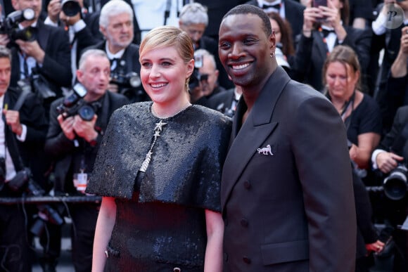 La présidente du jury Greta Gerwig et le membre du jury Omar Sy assistent au tapis rouge de "Megalopolis" lors de la 77e édition du Festival de Cannes au Palais des Festivals le 16 mai 2024. Shootpix/ABACAPRESS.COM