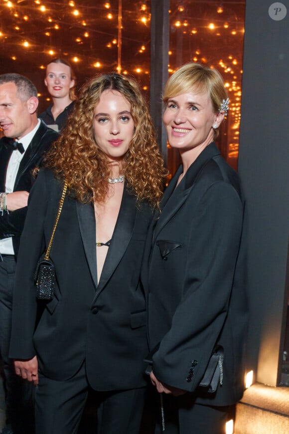 Judith Godreche et sa fille Tess Barthelemy, - Dîner "Women in Motion" par le groupe Kering, Place de la Castre, lors du 77ème Festival International du Film de Cannes le 19 mai 2024.