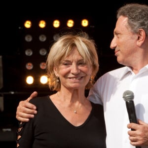 Colette, l'épouse de Jean Ferrat et Michel Drucker lors du spectacle organise à Fete de l'Humanite en hommage a Jean Ferrat. 80eme Fete de l'Humanite, qui se déroule au Parc de la Courneuve (93), La Courneuve, FRANCE - 11/09/2010