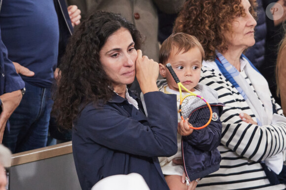 Xisca Perello (femme de Rafael Nadal) et son fils Rafael Junior - La famille de Rafael Nadal (Rafa) dans les tribunes pour le premier tour des Internationaux de France de tennis de Roland Garros 2024 opposant Rafael Nadal (Rafa) à Alexander Zverev, à Paris, France, le 27 mai 2024. © Jacovides-Moreau/Bestimage