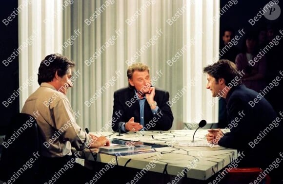 Philippe Gildas, Johnny Hallyday et Antoine de Caunes lors d'une émission "Nulle Part Ailleurs" de Canal+ en 1992. © Patrick Carpentier / Bestimage