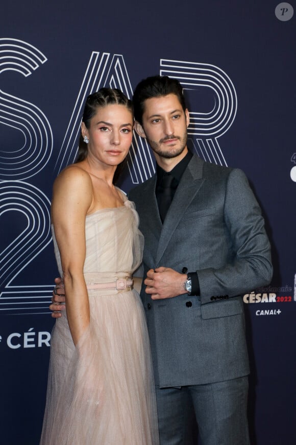 
Pierre Niney (habillé en Dior Homme et montre Montblanc) et sa compagne Natasha Andrews (habillée en Dior et bijoux Van Cleef & Arpels) - Photocall de la 47ème édition de la cérémonie des César à l'Olympia à Paris, le 25 février 2022. © Borde-Jacovides/Bestimage