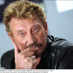 Johnny Hallyday à une conférence de presse pour le film L'Homme du train au festival international de film de Toronto, le 12 septembre 2002. Photo par Francis Petit/ABACA.