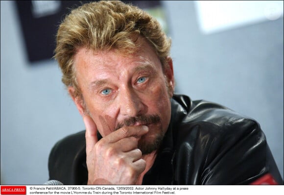 Johnny Hallyday à une conférence de presse pour le film L'Homme du train au festival international de film de Toronto, le 12 septembre 2002. Photo par Francis Petit/ABACA.