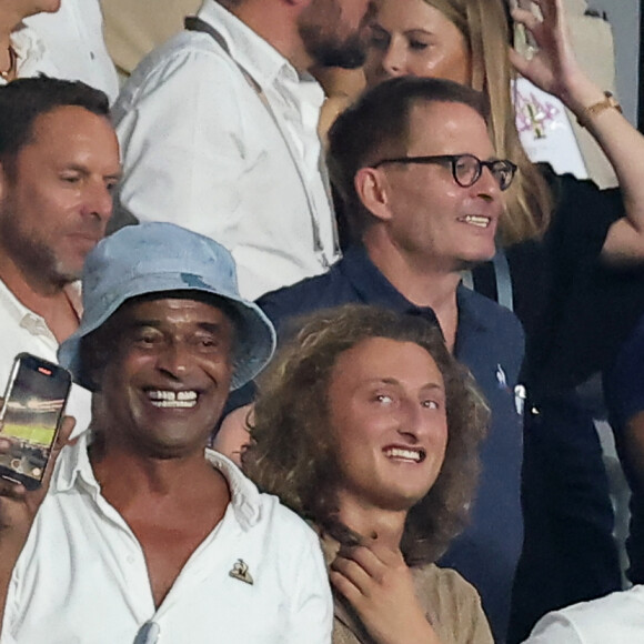Yannick Noah et son fils Joalukas dans les tribunes lord du match d'ouverture de la Coupe du Monde de Rugby France 2023 au Stade de France à Saint-Denis, le 8 septembre 2023