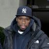 50 Cent se montre particulièrement menaçant avec un paparazzo à la sortie de son hôtel londonien, samedi 20 mars.