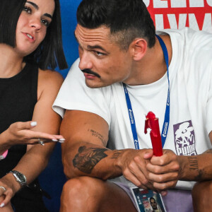 Florent Manaudou et sa nouvelle compagne Lola Dumenil dans les tribunes lors des Championnats de France de natation à Chartres le 18 Juin 2024. © Matthieu Mirville/Bestimage 