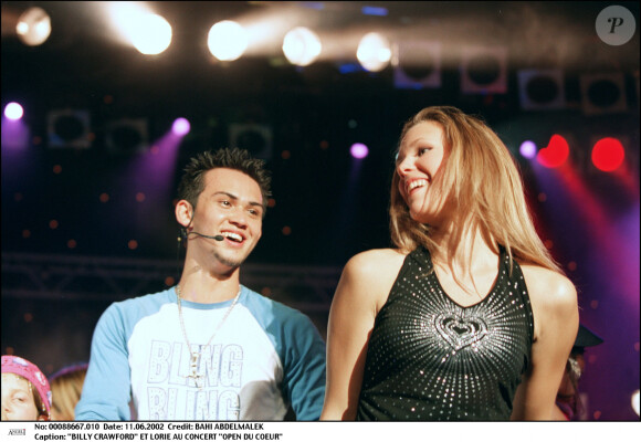 Les deux tourtereaux ont vécut leur histoire d'amour jusqu'au printemps 2004.
Billy Crawford et Lorie lors du concert "Open du coeur", le 11 juin 2002