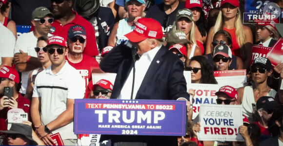 July 13, 2024: SOCIAL MEDIA. A livestream on Rumble of Donald Trump being struck by gunfire during an assassination attempt was made on his life at a 2024 U.S. Presidential Election campaign rally in Butler Pennsylvania...President Donald Trump was grazed in the ear by a bullet in the from an alleged sniper from outside the MAGA campaign event perimeter from an elevated 1-story building. The U.S. Secret Service is reporting that two political supporters have been killed by gunfire and the alleged assailant was neutralized by law enforcement executive protection counter snipers. © Taidgh Barron/ZUMA Press/Bestimage 