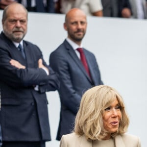 Emmanuel Macron, président de la République avec son épouse Brigitte à la cérémonie du 144ème défilé militaire du 14 juillet, jour de la Fête Nationale, à Paris