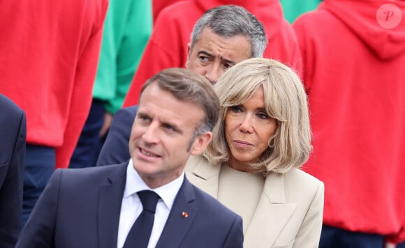 Le Président de la République française Emmanuel Macron et sa femme la Première Dame française Brigitte Macron lors d'un bain de foule à la cérémonie du 144ème défilé militaire du 14 juillet, jour de la Fête Nationale, à Paris, France, le 14 juillet 2024