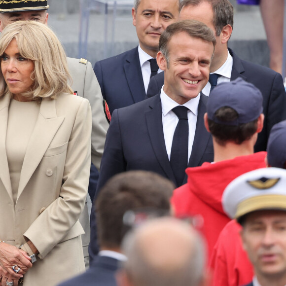 Le Président de la République française Emmanuel Macron et sa femme la Première Dame française Brigitte Macron lors d'un bain de foule à la cérémonie du 144ème défilé militaire du 14 juillet, jour de la Fête Nationale, à Paris, France, le 14 juillet 2024