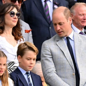 La maman de trois enfants a expliqué clairement à la reine Elizabeth II et à son beau-père, le roi Charles III, qu'elle ferait toujours passer ses enfants en premier. 
Tennis : Wimbledon 2023 - Angleterre - Finale simple Messieurs- Victoire de Carlos Alcaraz Espagne contre Novak Djokovic Serbie - Royal Box - Prince William, Prince George et Princesse Charlotte regardent la remise de prix faite par la Princesse de Galles