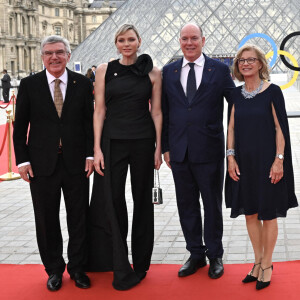 President of the International Olympic Committee (IOC) Thomas Bach (L) and his wife Claudia Bach (R) pose with Prince Albert II of Monaco and his wife Charlene, Princess of Monaco upon their arrival at the Pyramide du Louvre, designed by Ieoh Ming Pei, to attend a gala dinner hosted by the International Olympic Committee (IOC) and the French Presidency at the Louvre Museum in Paris, on the eve of the opening ceremony of the Paris 2024 Olympic Games, on July 25, 2024. Photo by Jeanne Accorsini/Pool/ABACAPRESS.COM